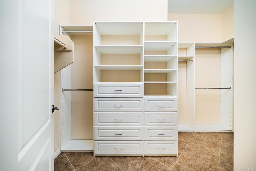 1075 Crimson Drive San Marcos, CA 92069 - Photo 17 of 74 a view of walk in closet with empty racks