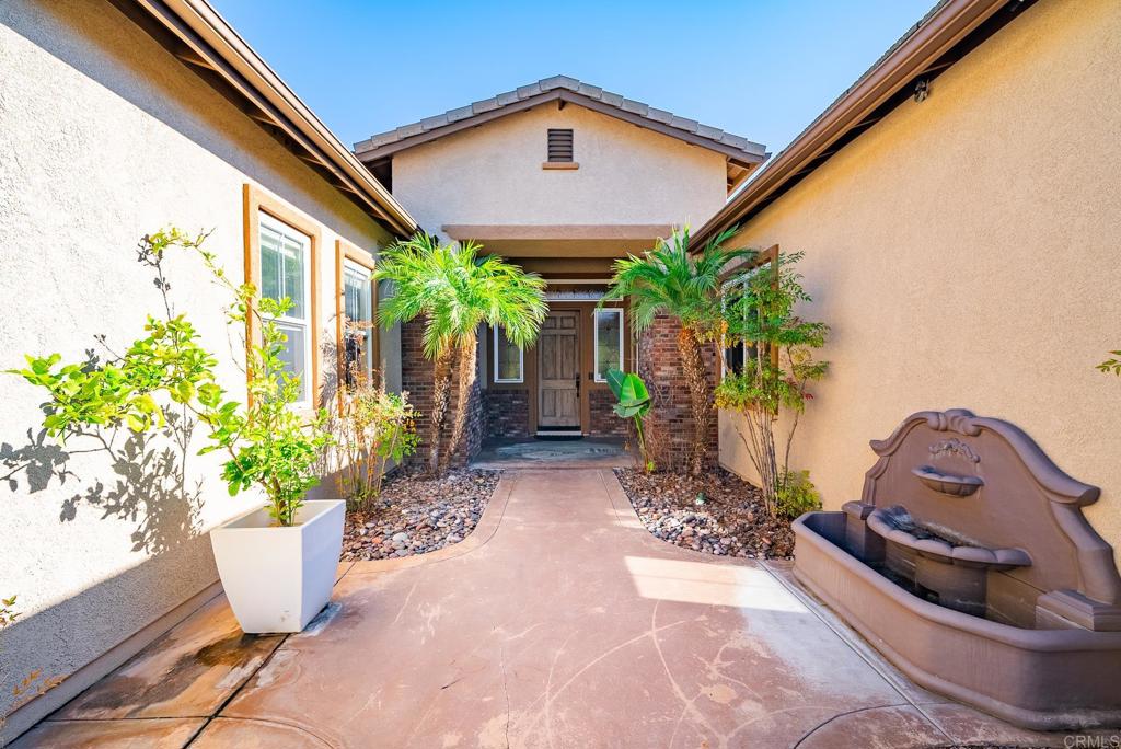 1075 Crimson Drive San Marcos, CA 92069 - Photo 41 of 74 a front view of house with potted plant