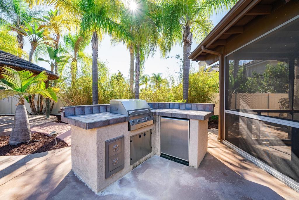 1075 Crimson Drive San Marcos, CA 92069 - Photo 49 of 74 a view of a kitchen with a sink and wooden floor