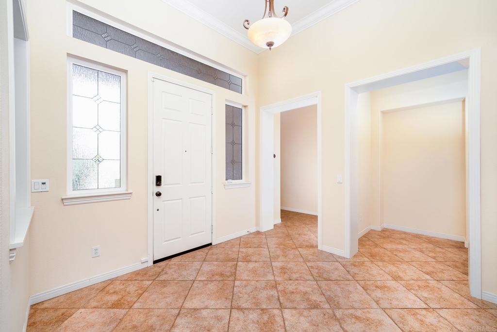 1075 Crimson Drive San Marcos, CA 92069 - Photo 7 of 74 a view of an empty room with window and cabinet