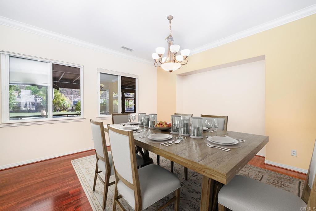 1075 Crimson Drive San Marcos, CA 92069 - Photo 10 of 74 a view of a dining room with furniture window and wooden floor