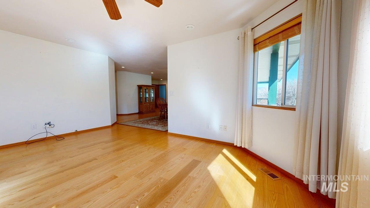 2794 9th Avenue Clarkston, WA 99403 - Photo 7 of 34 Unfurnished room with light wood finished floors, a ceiling fan, and recessed lighting