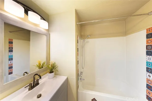 a view of a bathroom with wooden floor