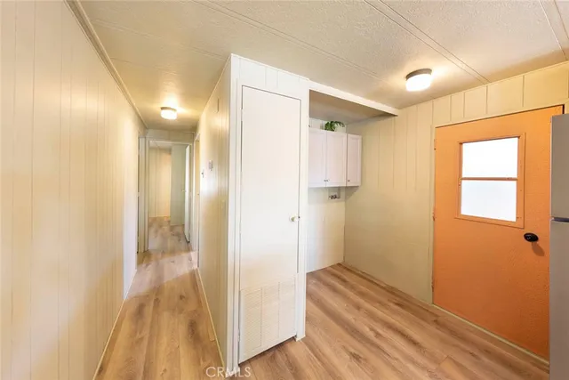 a large white kitchen with a large window