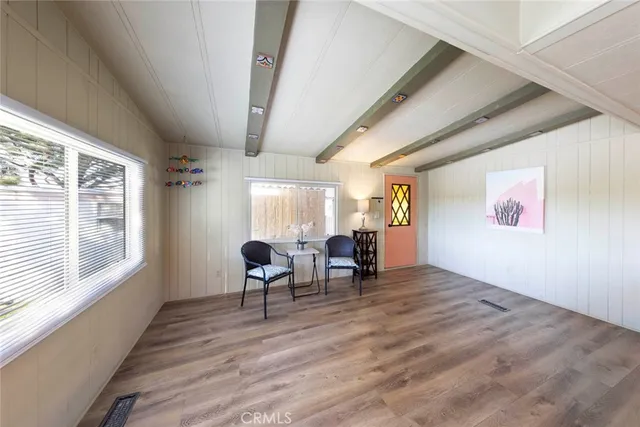 a open kitchen with stainless steel appliances kitchen island granite countertop a stove and a refrigerator