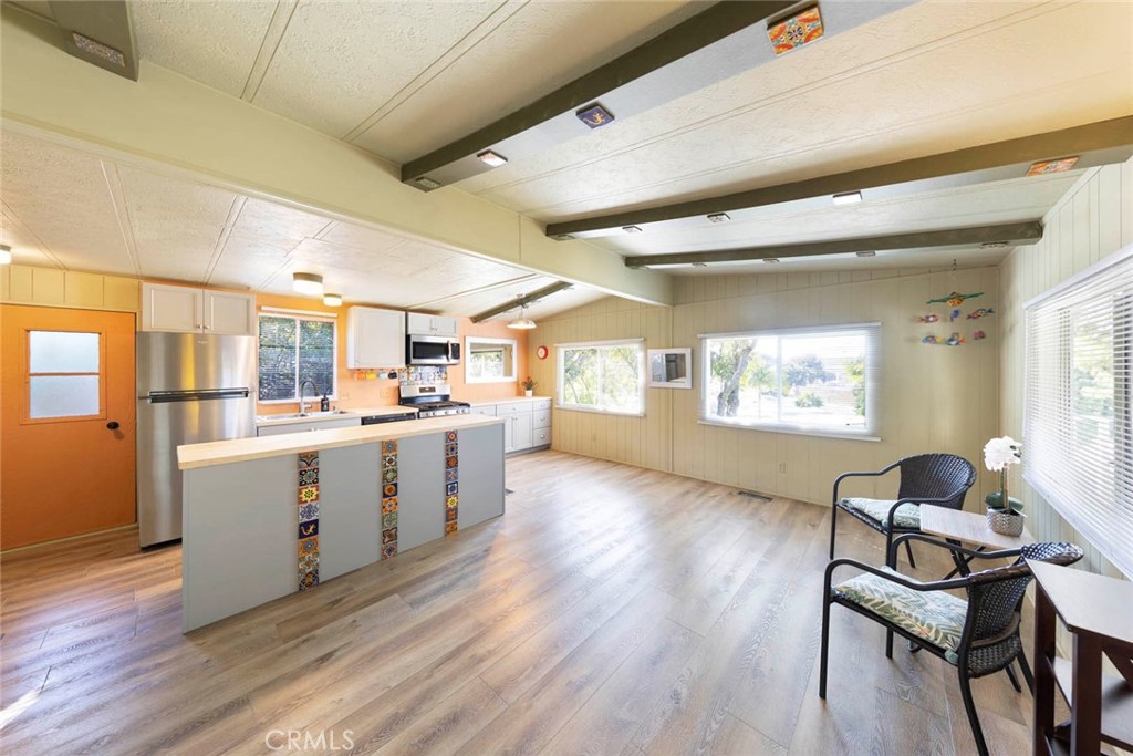 32802 Valle Road, Unit 108 San Juan Capistrano, CA 92675 - Photo 24 of 32 a kitchen with sink cabinets and wooden floor