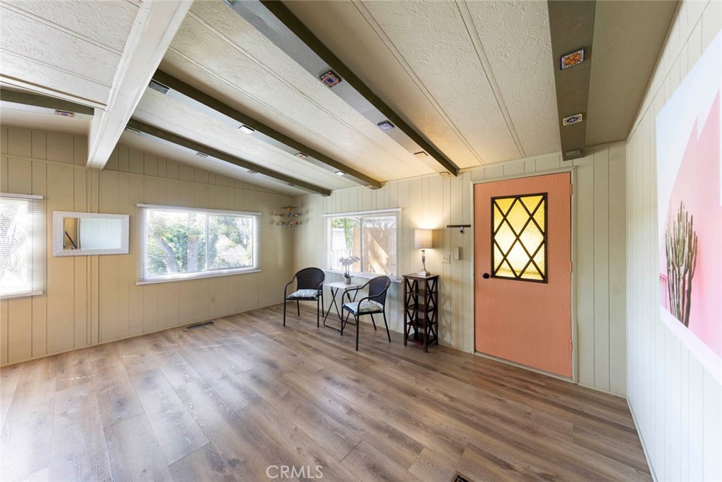 32802 Valle Road, Unit 108 San Juan Capistrano, CA 92675 - Photo 25 of 32 a view of a dining room with furniture window and wooden floor