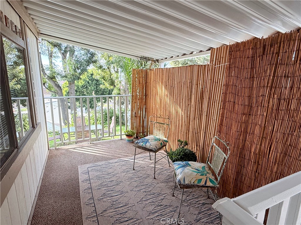 32802 Valle Road, Unit 108 San Juan Capistrano, CA 92675 - Photo 5 of 32 a living room with furniture and a flat screen tv