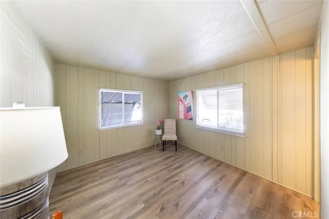 a bathroom with a sink a toilet a mirror and shower