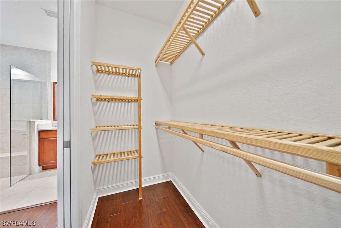 19630 Tesoro Way Estero, FL 33967 - Photo 15 of 44 a view of a room with racks on the wall