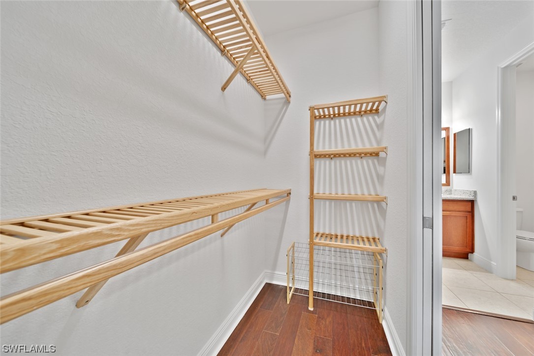 19630 Tesoro Way Estero, FL 33967 - Photo 17 of 44 a view of a room with wooden floor and staircase