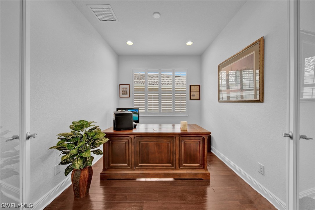 19630 Tesoro Way Estero, FL 33967 - Photo 22 of 44 a house view with a potted plant on a table
