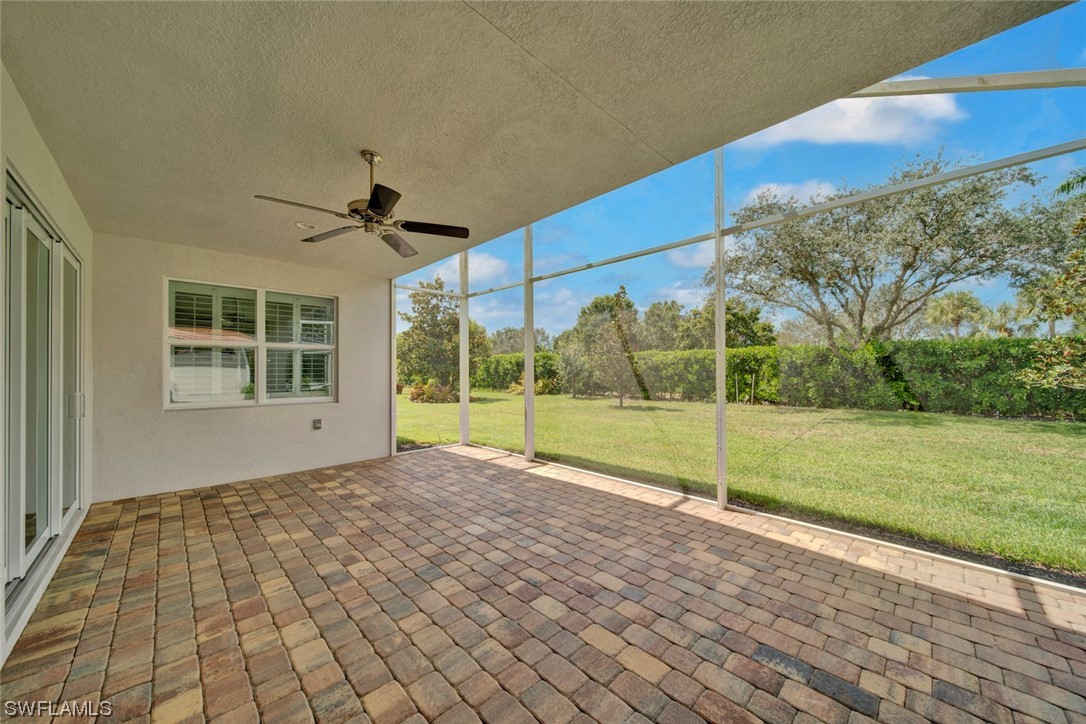 19630 Tesoro Way Estero, FL 33967 - Photo 24 of 44 a view of a house with a yard
