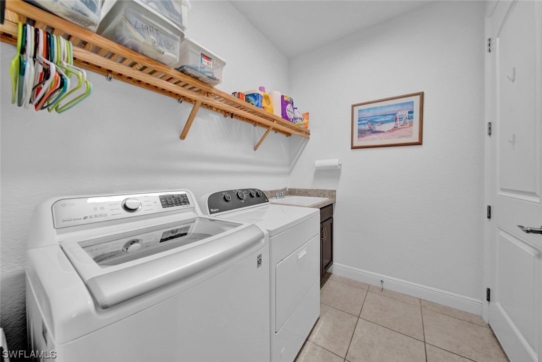 19630 Tesoro Way Estero, FL 33967 - Photo 25 of 44 a utility room with dryer and washer