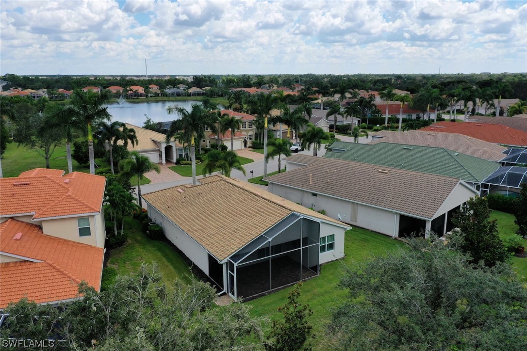 19630 Tesoro Way Estero, FL 33967 - Photo 28 of 44 an aerial view of a house with yard and mountain view in back