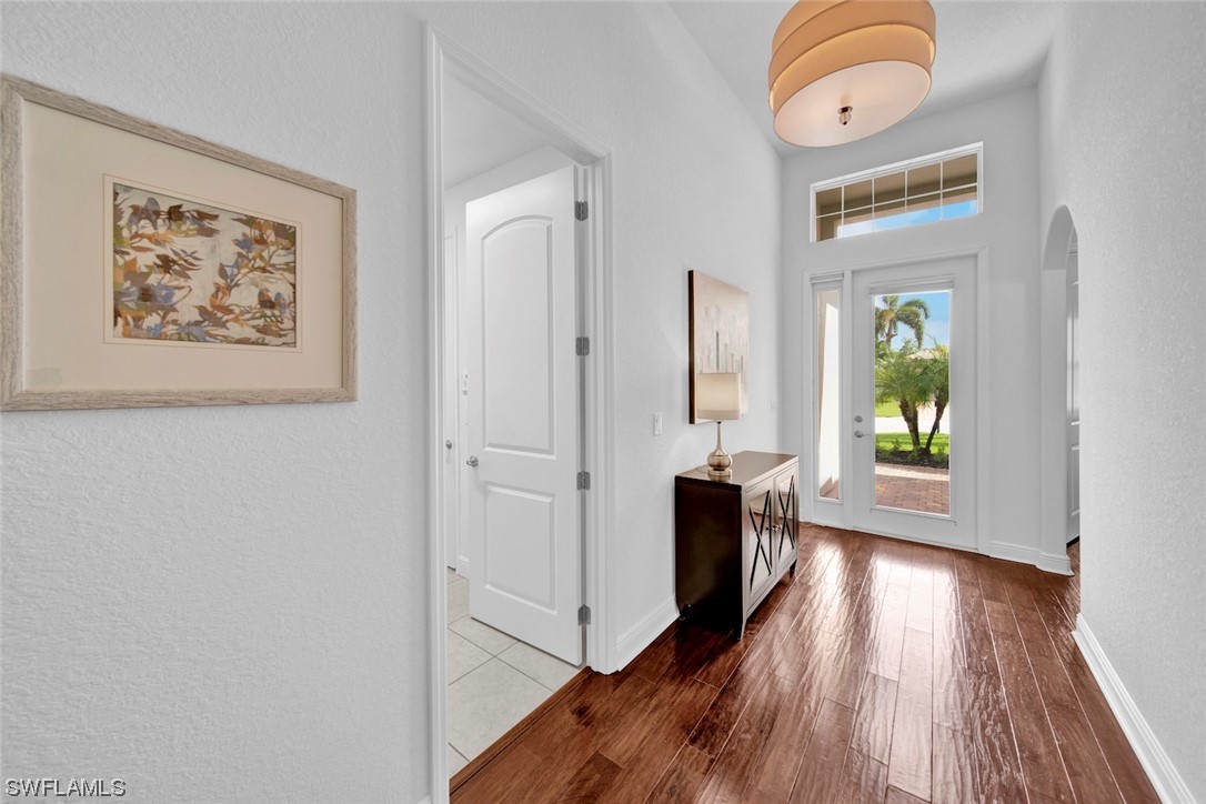 19630 Tesoro Way Estero, FL 33967 - Photo 3 of 44 a view of hallway with wooden floor