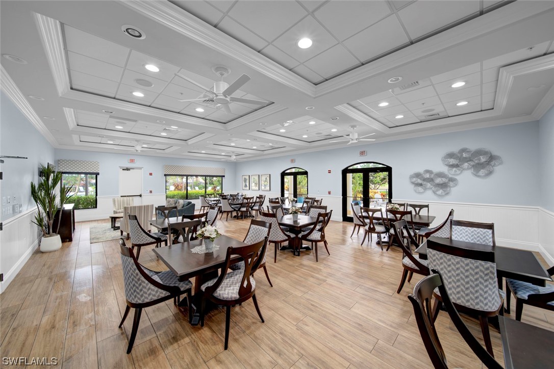 19630 Tesoro Way Estero, FL 33967 - Photo 34 of 44 a view of a dining room with furniture and wooden floor