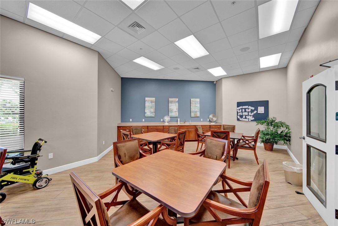 19630 Tesoro Way Estero, FL 33967 - Photo 37 of 44 a view of a dining room with furniture and a livingroom