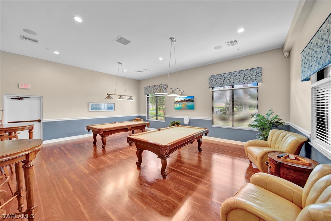 19630 Tesoro Way Estero, FL 33967 - Photo 38 of 44 a living room with furniture a table and a potted plant