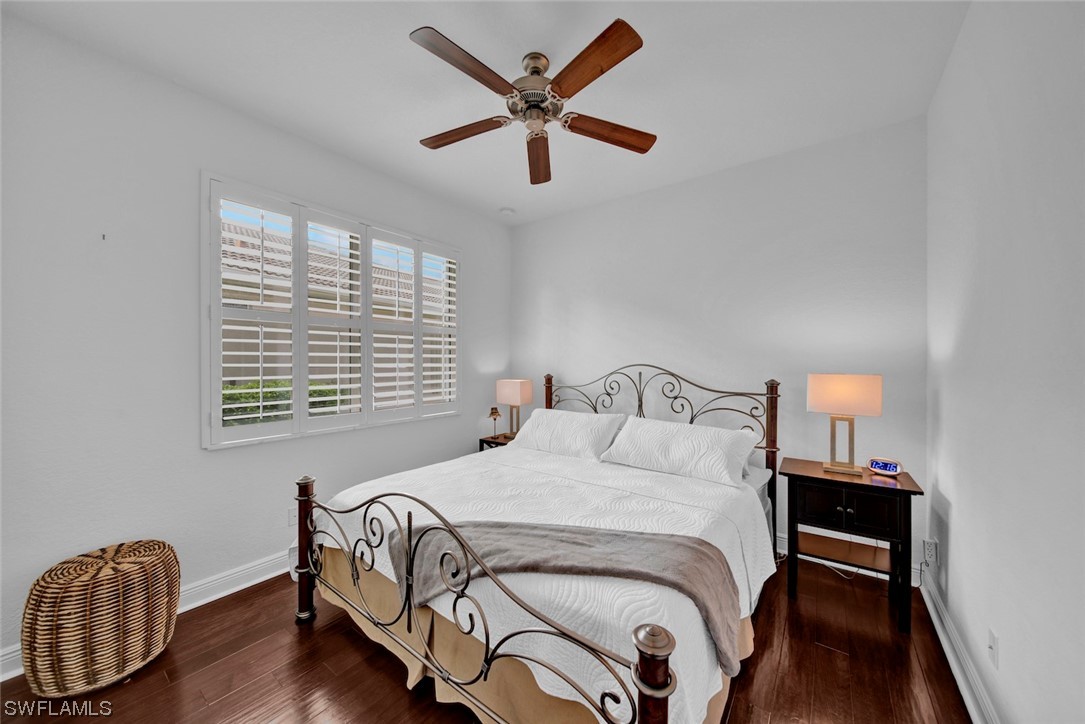 19630 Tesoro Way Estero, FL 33967 - Photo 4 of 44 a bedroom with a bed and a table