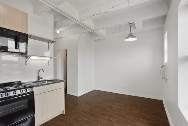 a kitchen with a stove and a refrigerator