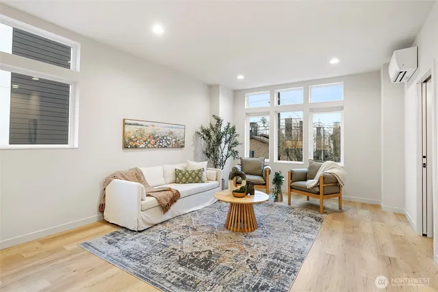 a living room with furniture and a rug