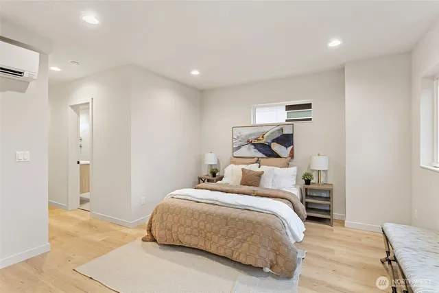 a bedroom with a bed and a night stand