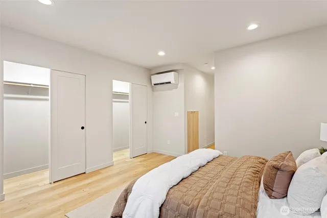 a bedroom with a bed and a shower