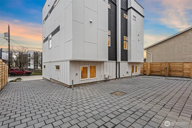 a view of a street with brick wall