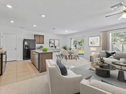a open kitchen with cabinets and appliances