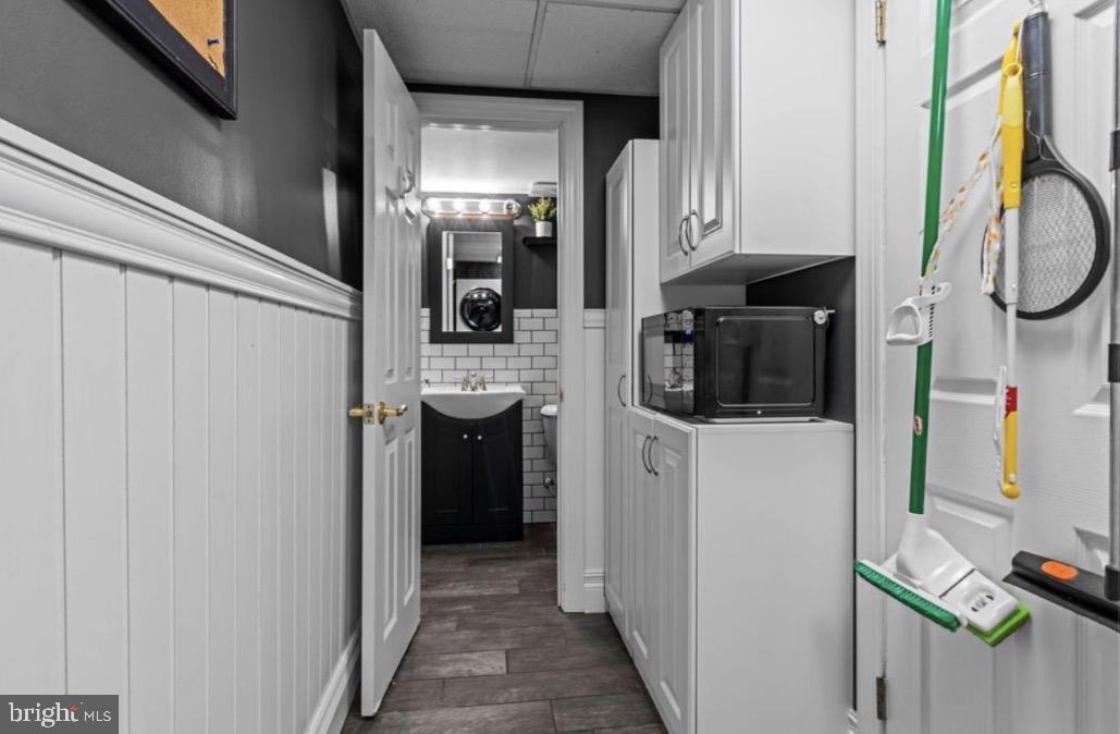 809 Millwood Road Philadelphia, PA 19115 - Photo 12 of 20 a kitchen with a refrigerator and cabinets