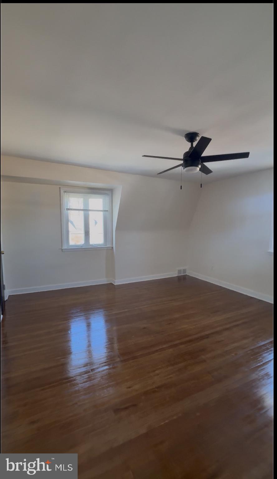 809 Millwood Road Philadelphia, PA 19115 - Photo 18 of 20 a view of empty room with wooden floor and fan