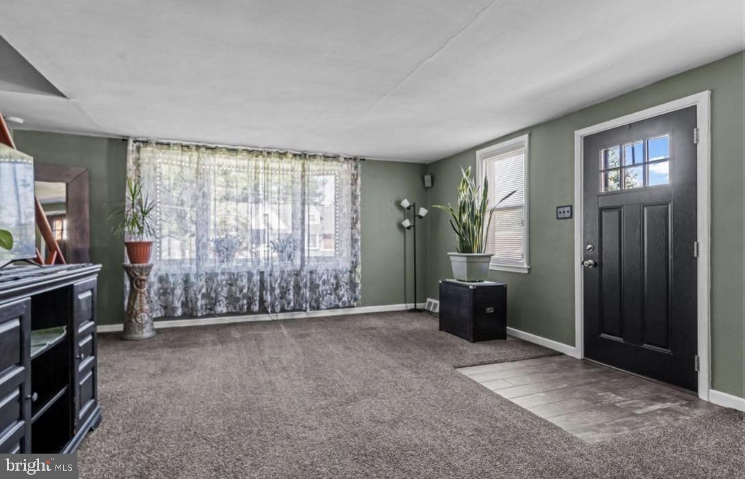 809 Millwood Road Philadelphia, PA 19115 - Photo 5 of 20 a view of an empty room with furniture and a window