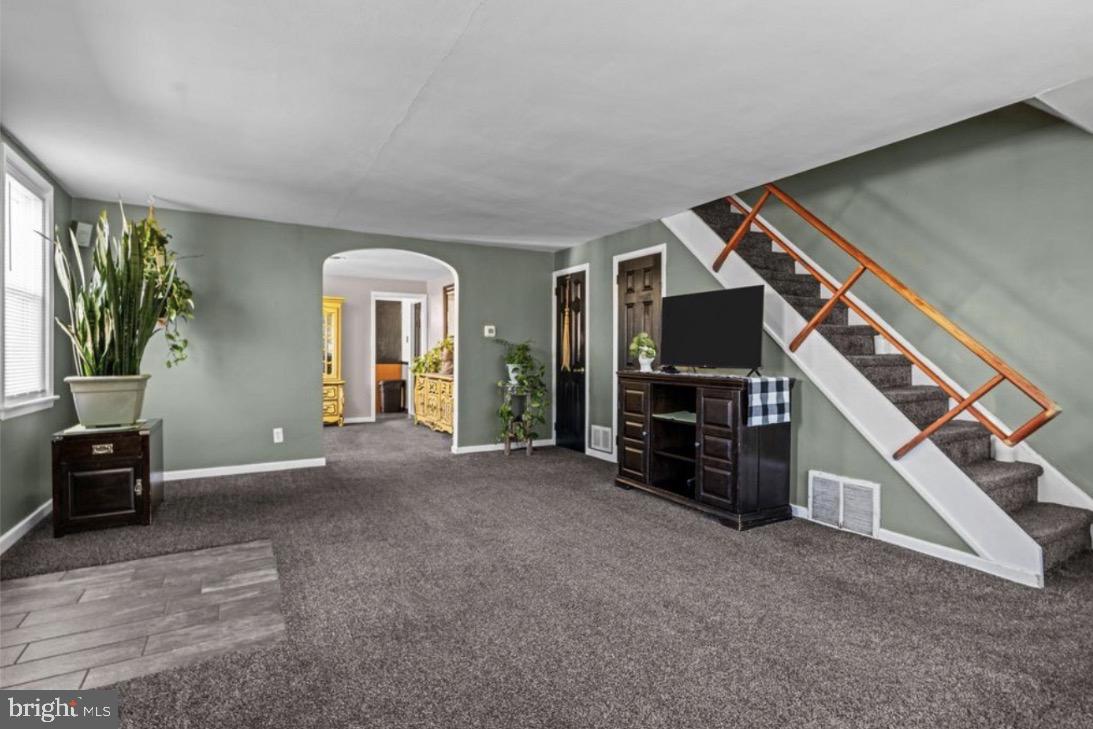 809 Millwood Road Philadelphia, PA 19115 - Photo 6 of 20 a view of a livingroom with furniture and a flat screen tv