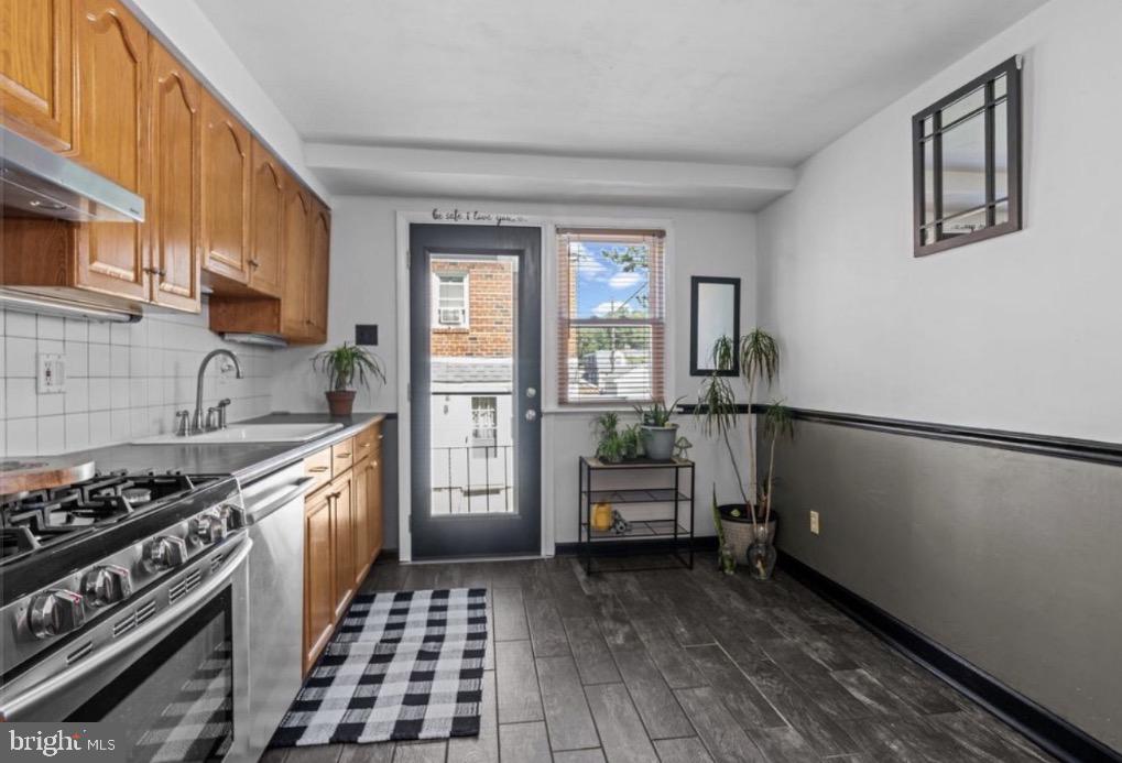 809 Millwood Road Philadelphia, PA 19115 - Photo 8 of 20 a kitchen with sink cabinets and stove