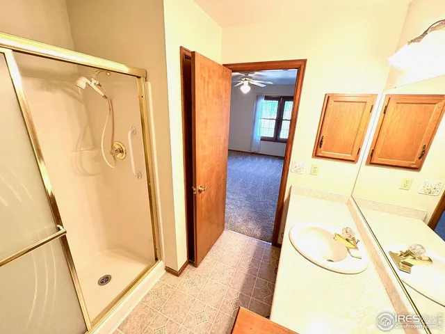a bathroom with a tub and a glass door shower