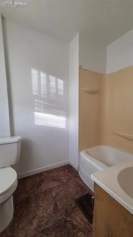 a bathroom with a sink and a toilet
