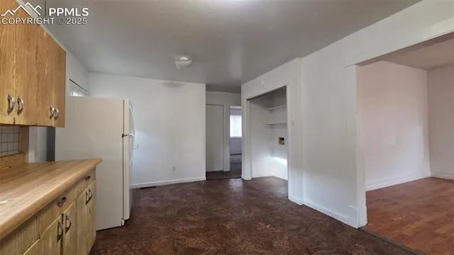 a view of a kitchen cabinets and a counter place