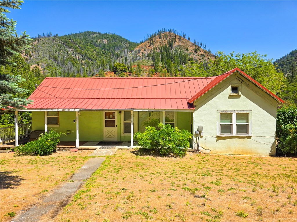 38703 Highway 96 Klamath River, CA 96050 - Photo 1 of 37 a view of a house with a yard and potted plants