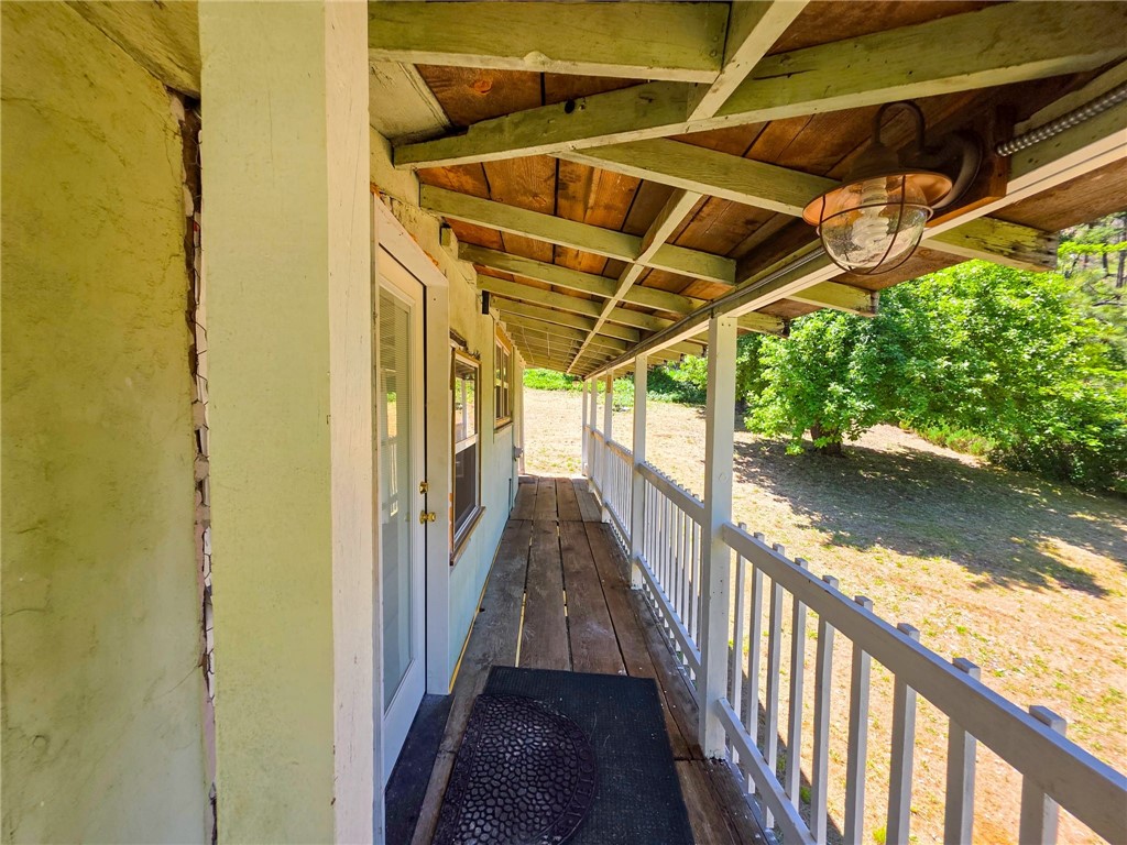 38703 Highway 96 Klamath River, CA 96050 - Photo 17 of 37 a view of a balcony with wooden floor and lake view