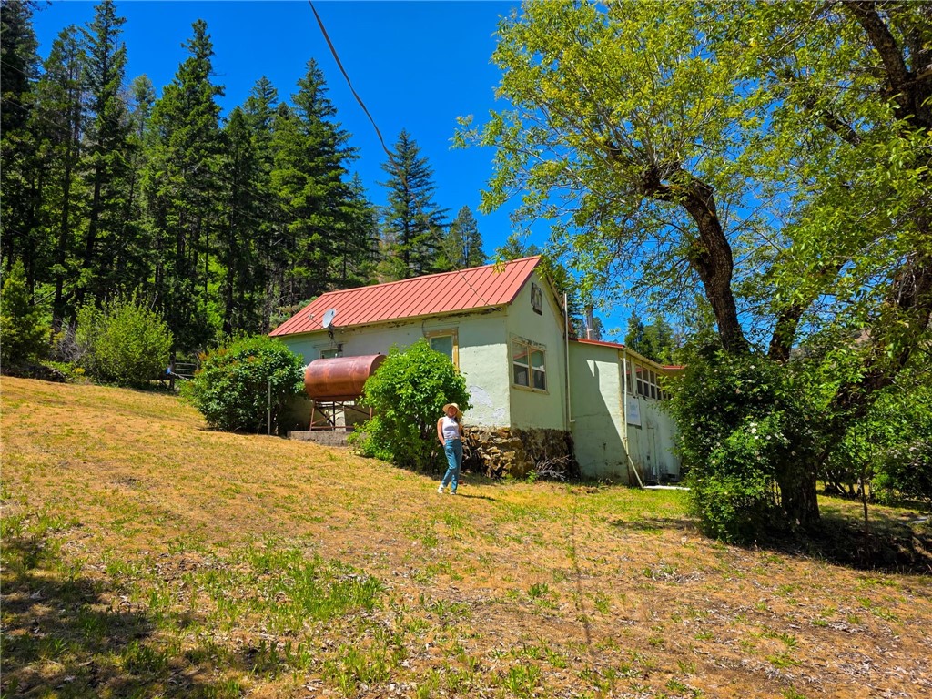 38703 Highway 96 Klamath River, CA 96050 - Photo 22 of 37 a front view of a house with a yard