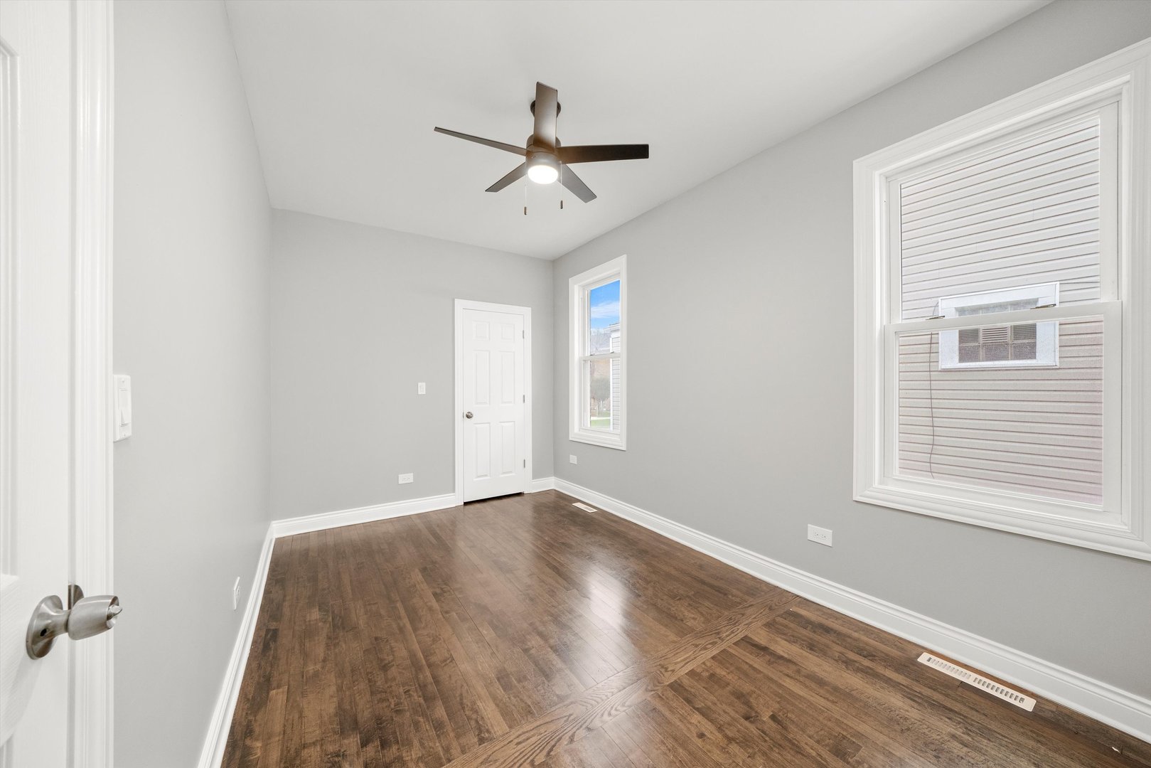 5237 Long Avenue Chicago, IL 60638 - Photo 12 of 41 a view of an empty room with wooden floor and a window