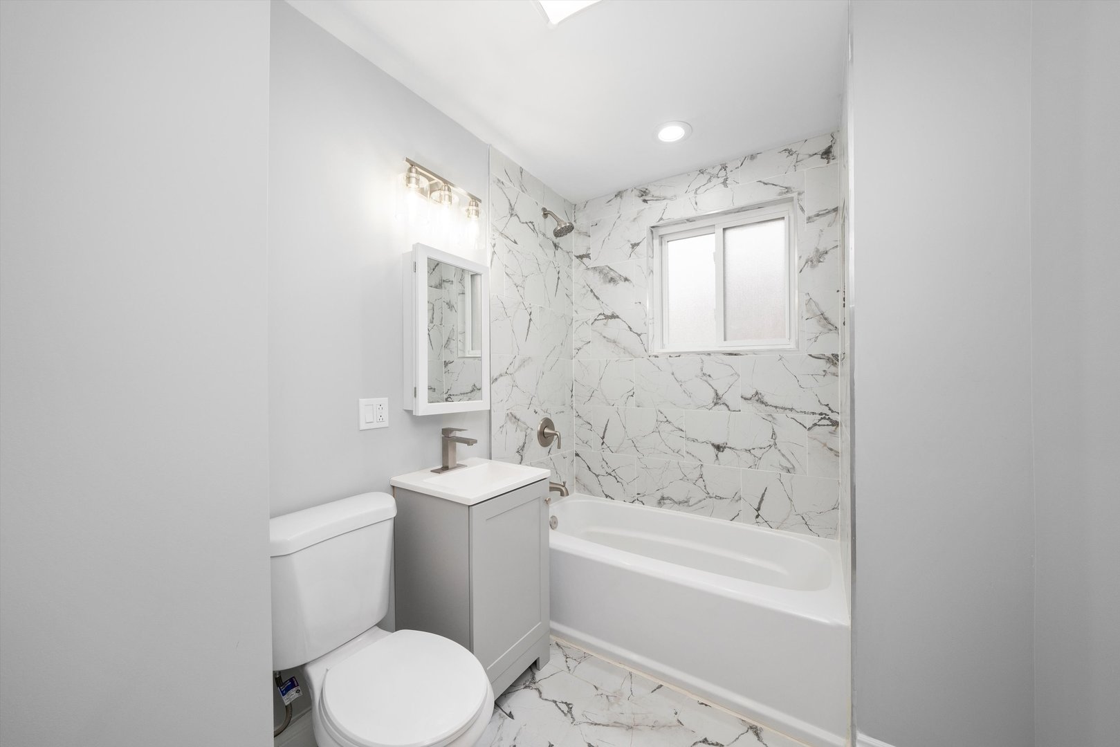 5237 Long Avenue Chicago, IL 60638 - Photo 16 of 41 a bathroom with a toilet a sink and bathtub
