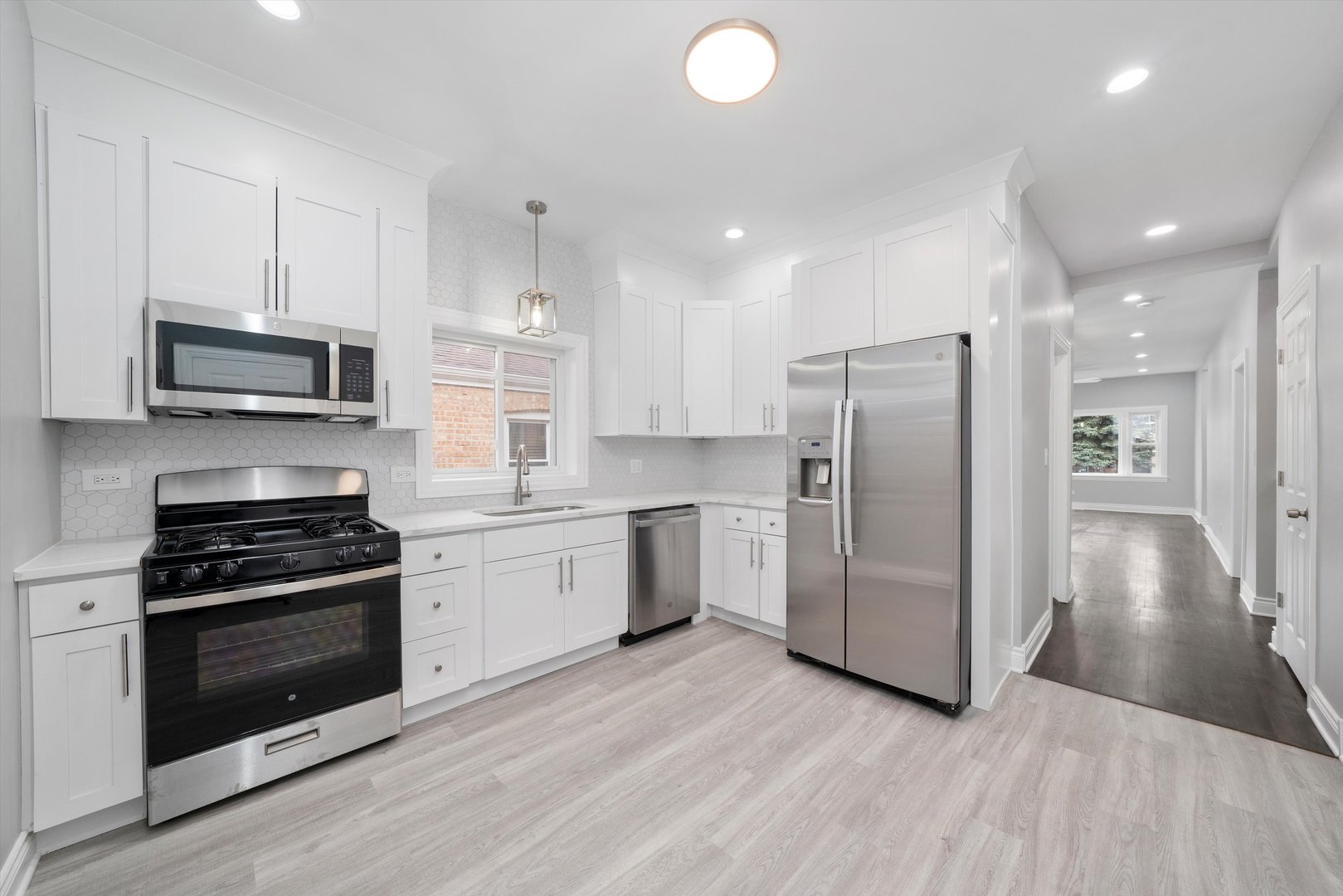 5237 Long Avenue Chicago, IL 60638 - Photo 9 of 41 a kitchen with a refrigerator and a stove top oven
