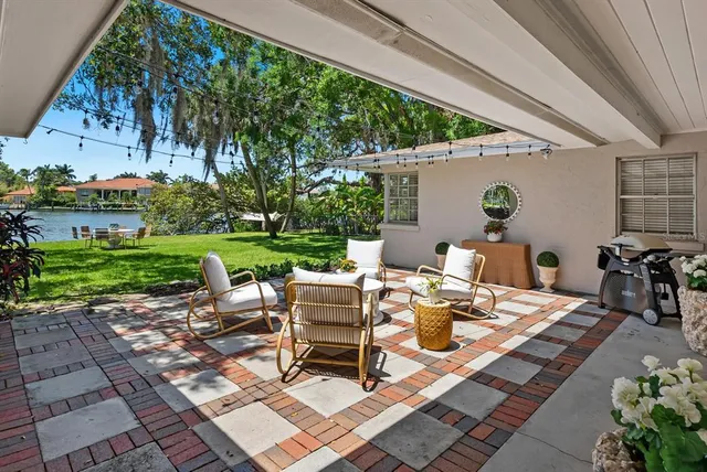 a view of a brick house with a yard
