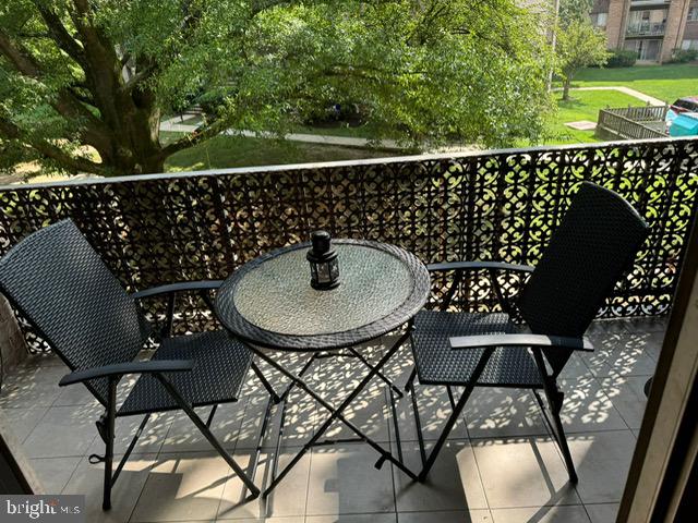 3744 Bel Pre Road, Unit 10 Silver Spring, MD 20906 - Photo 13 of 23 a table and chairs with the view of yellow