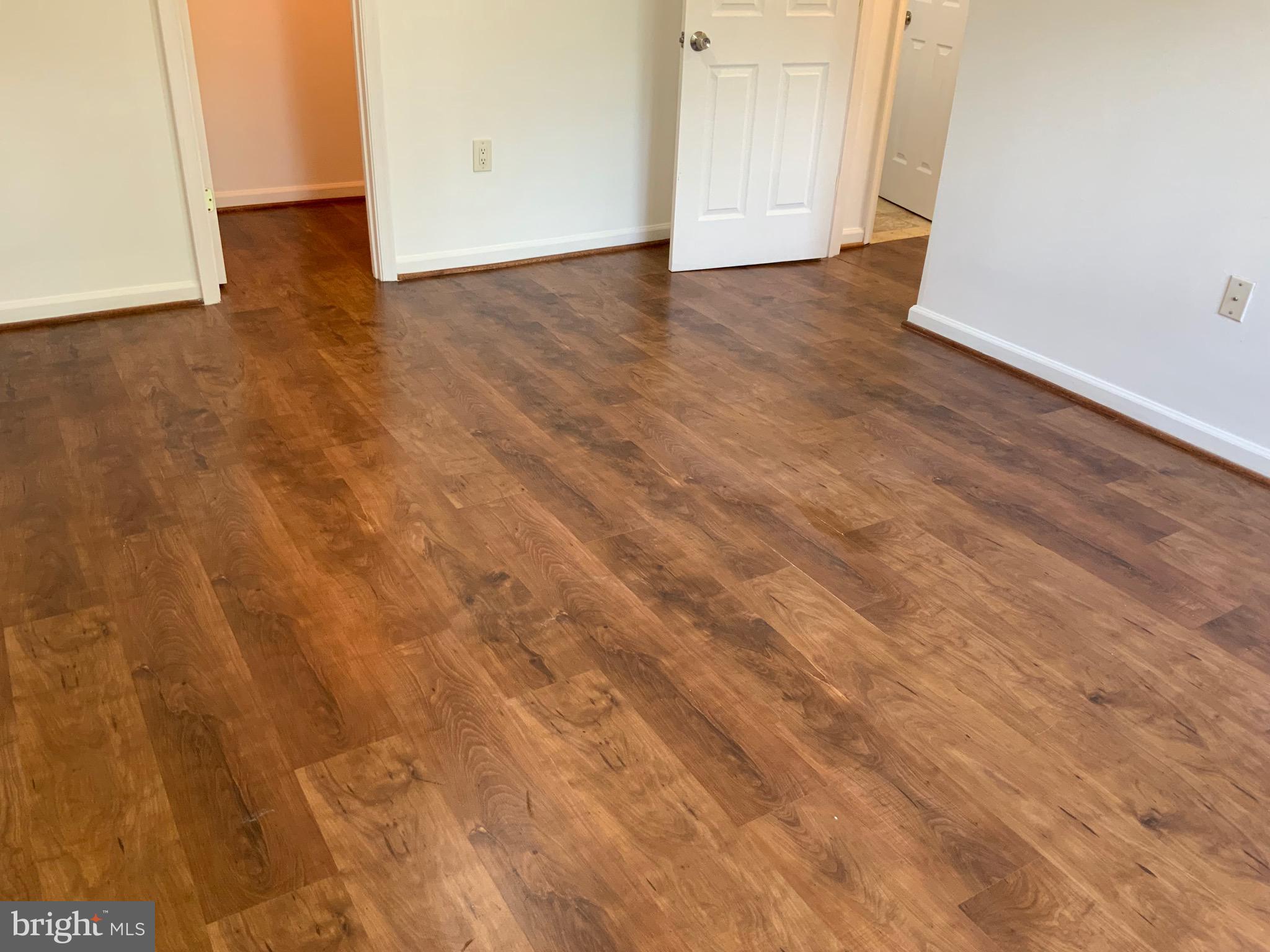 3744 Bel Pre Road, Unit 10 Silver Spring, MD 20906 - Photo 15 of 23 a view of an empty room with wooden floor