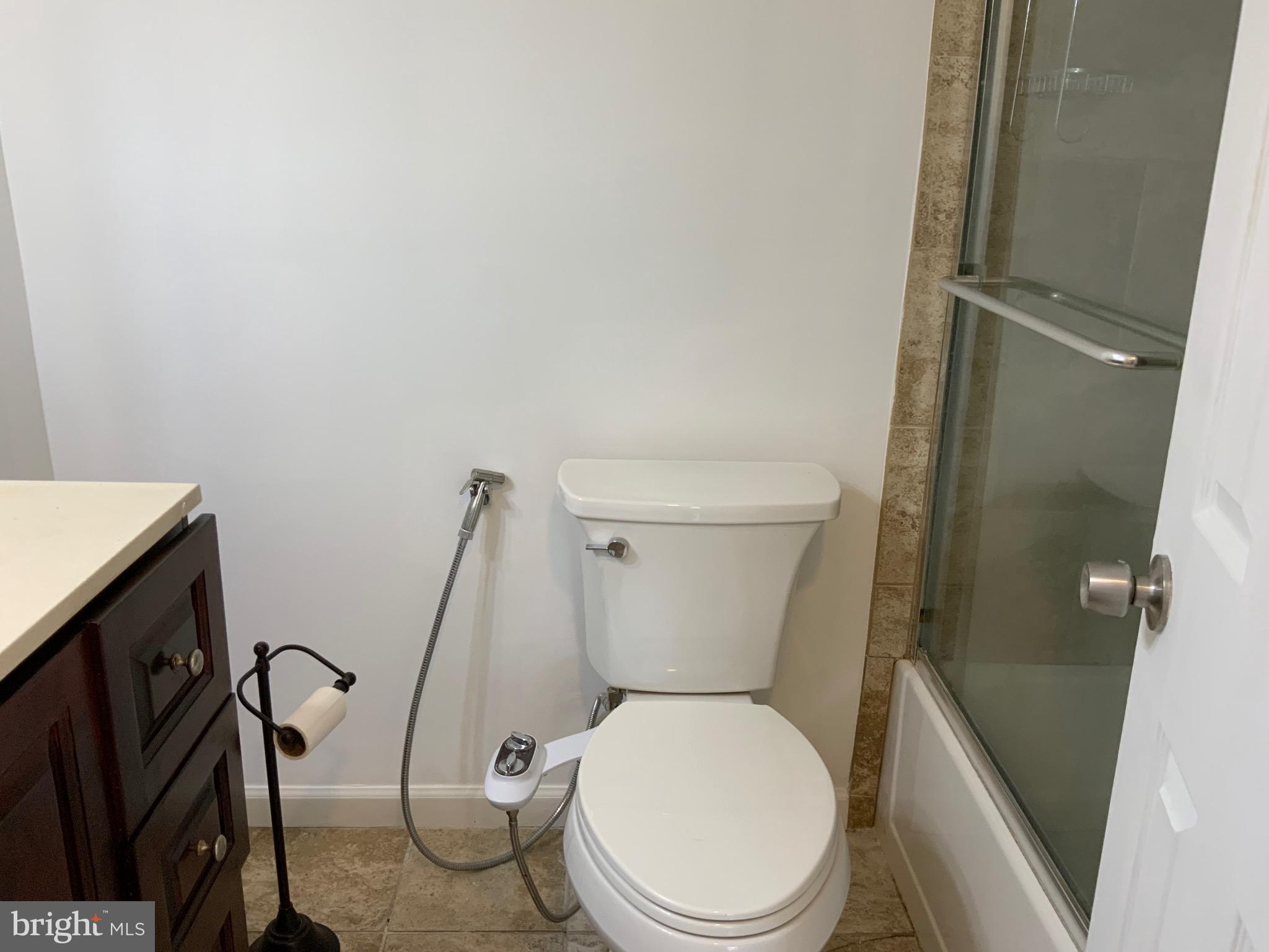 3744 Bel Pre Road, Unit 10 Silver Spring, MD 20906 - Photo 18 of 23 a white toilet sitting next to a sink