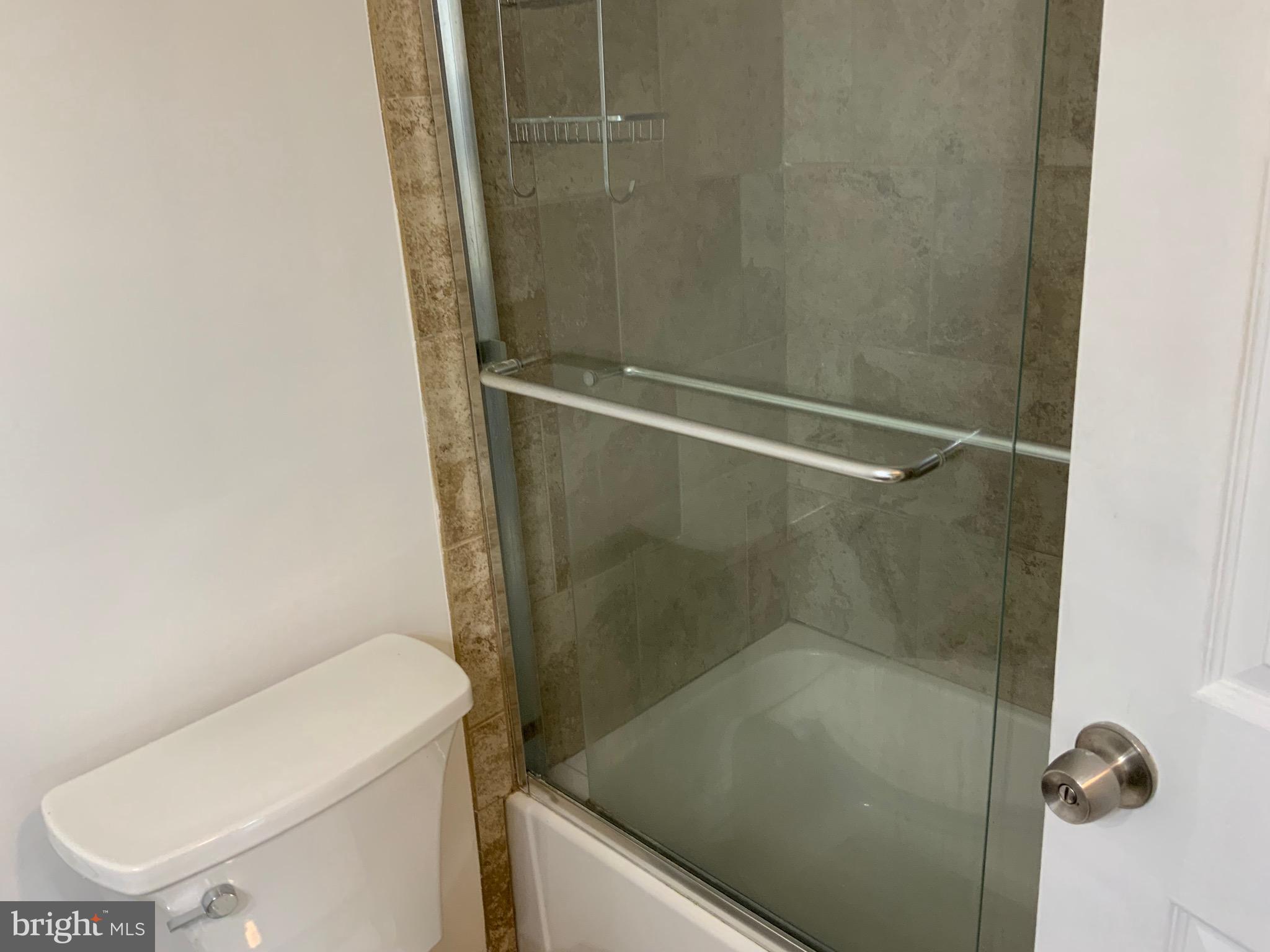 3744 Bel Pre Road, Unit 10 Silver Spring, MD 20906 - Photo 19 of 23 a bathroom with a shower and toilet