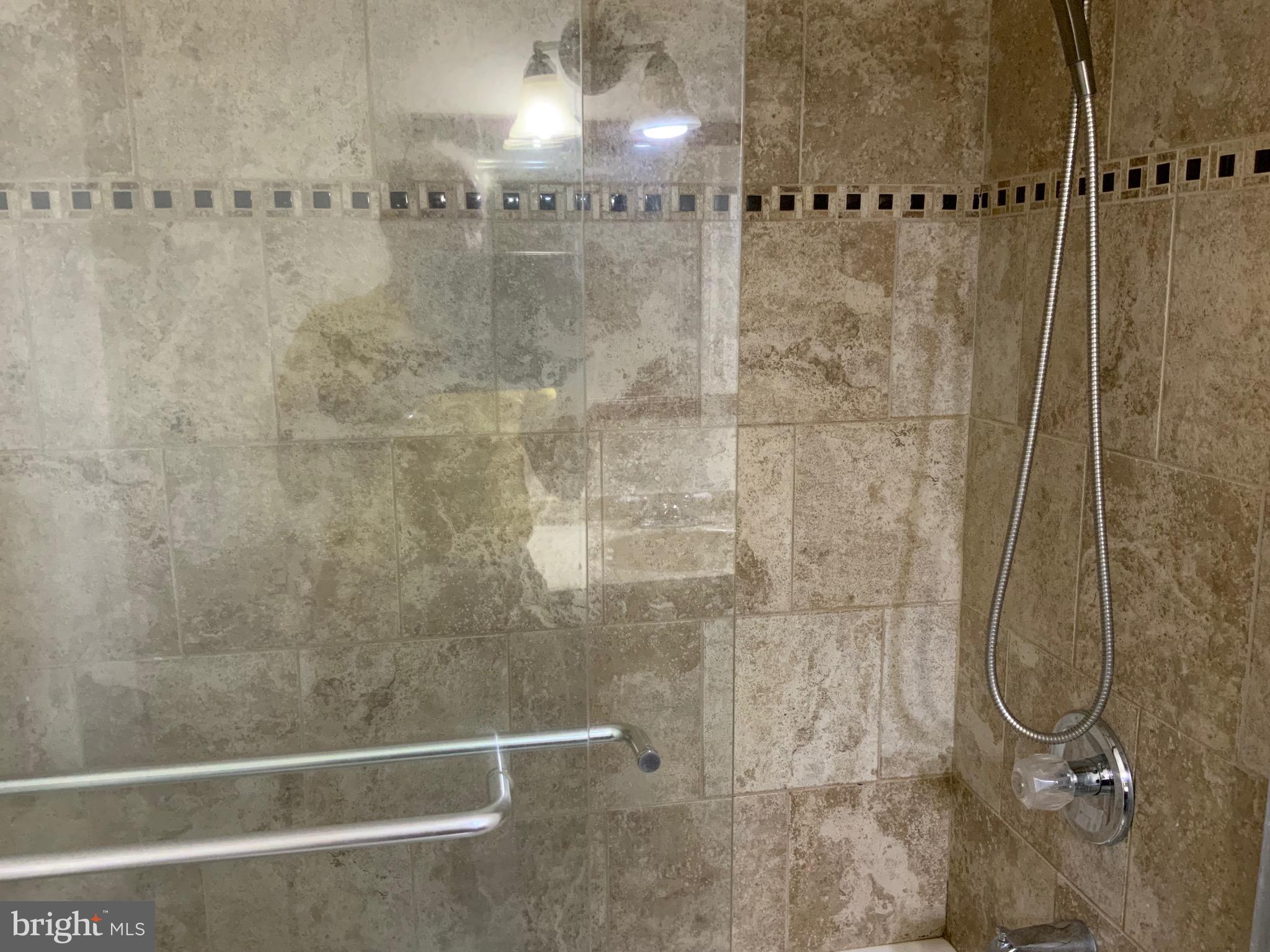 3744 Bel Pre Road, Unit 10 Silver Spring, MD 20906 - Photo 20 of 23 a bathroom with a shower